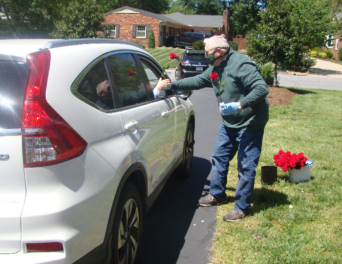 George Brown giving out Roses